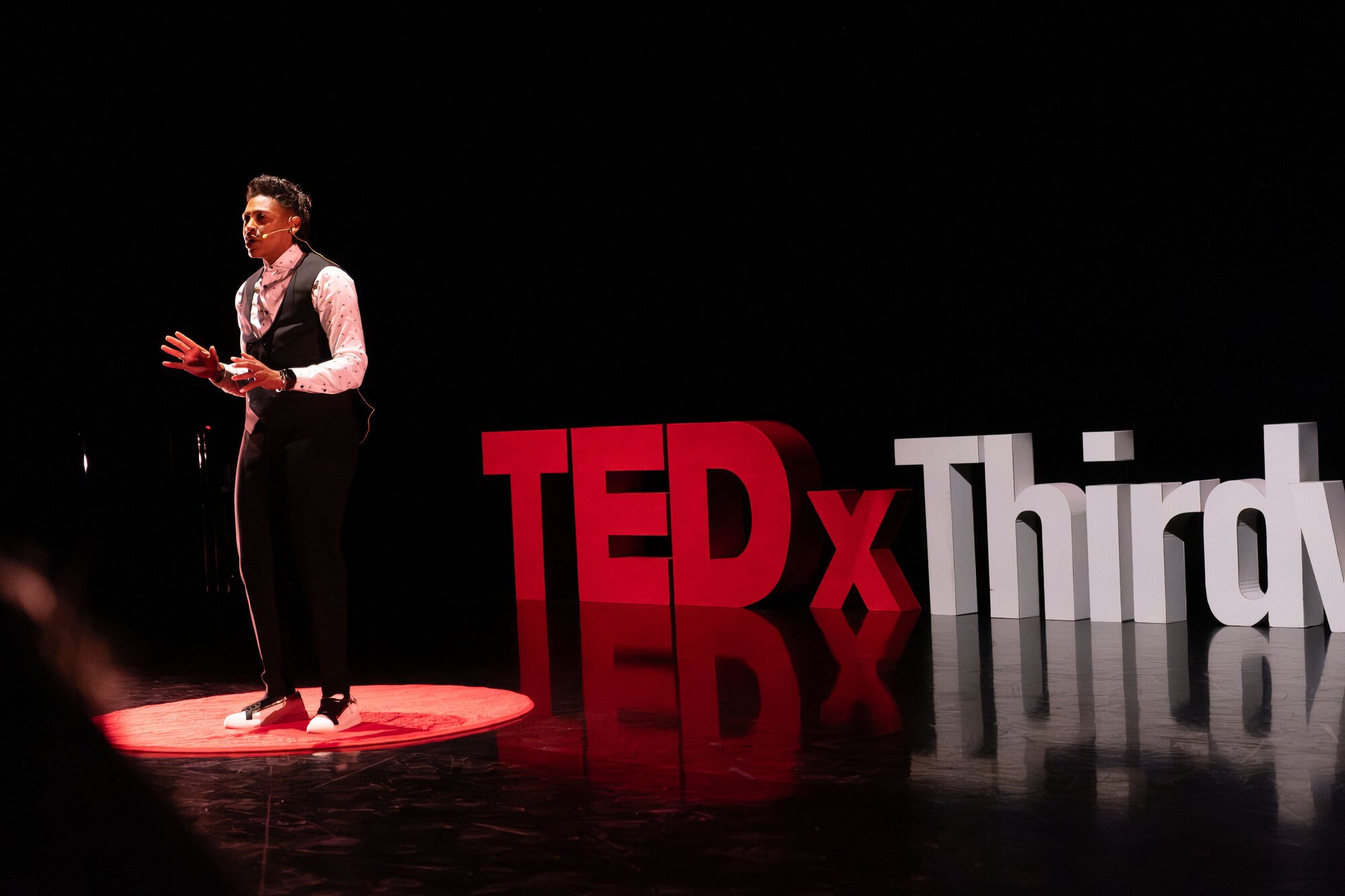 Khaliah O. Guillory delivering a keynote on stage