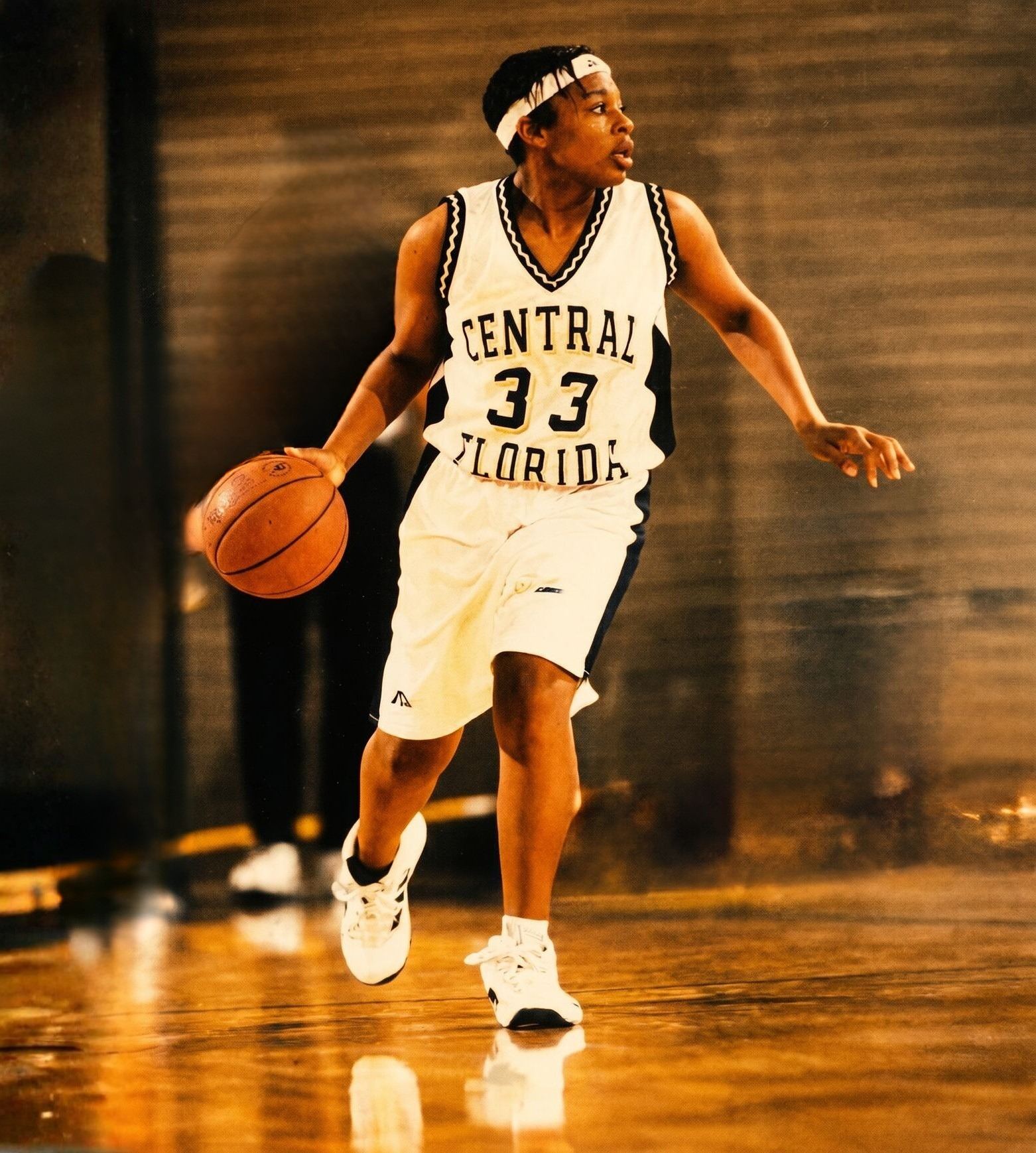Khaliah O. Guillory in the Central Florida number 33 jersey, driving with the ball