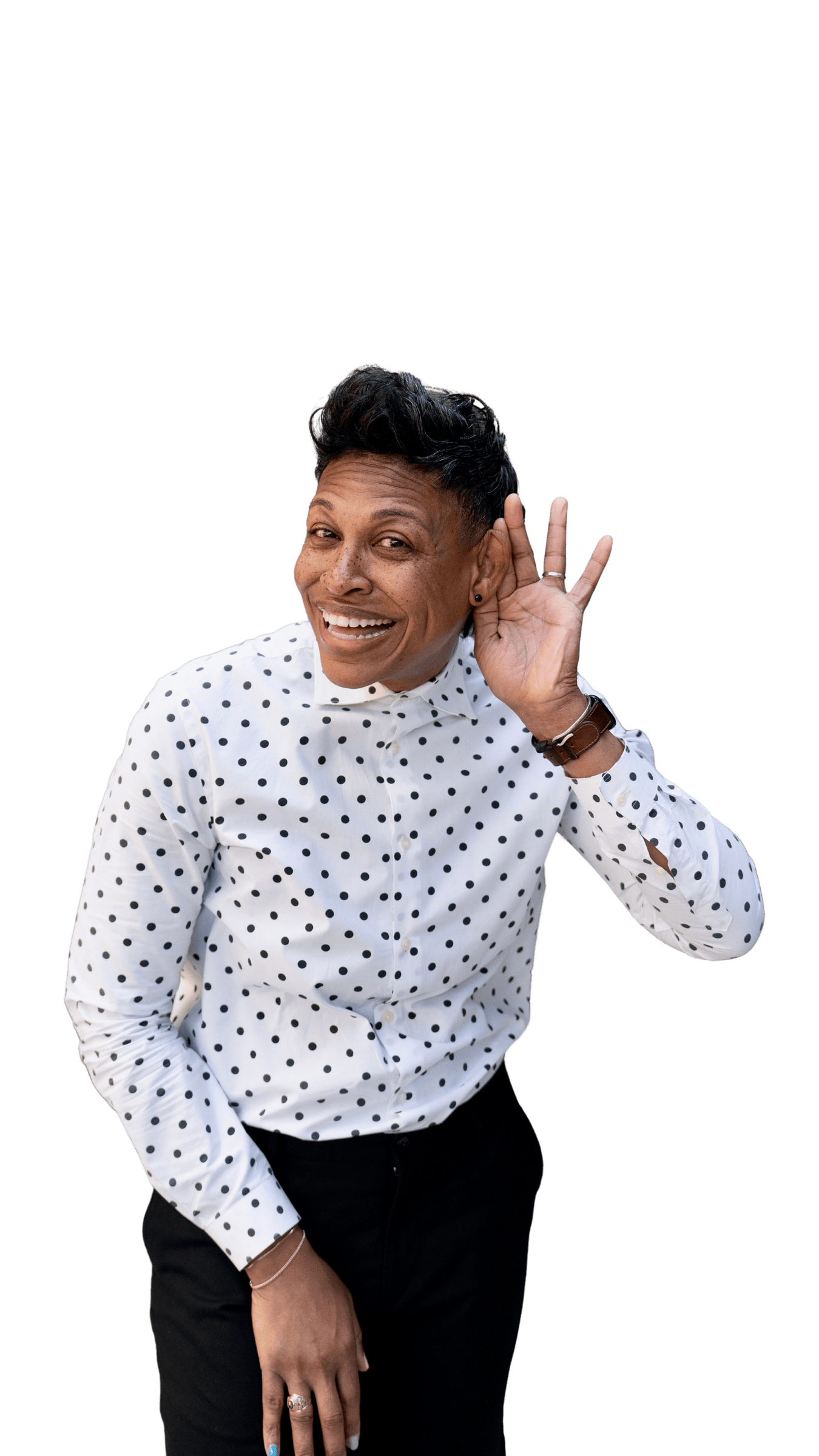 Khaliah O. Guillory in a polka-dot shirt, cupping a hand to her ear