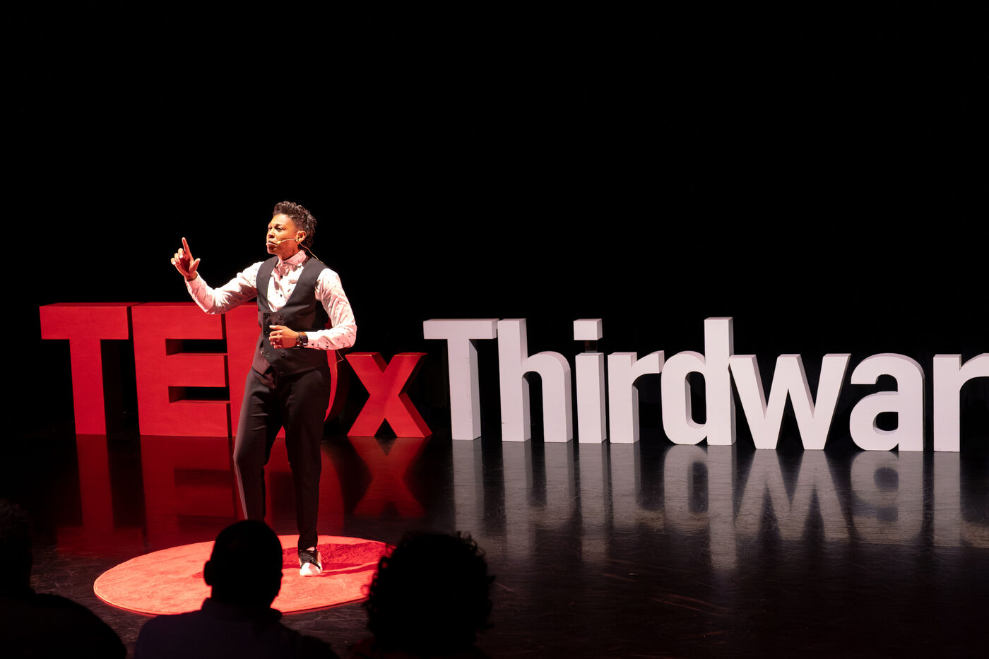 Khaliah O. Guillory speaking on the TEDx Thirdward stage