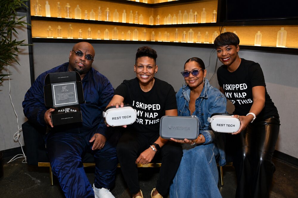 CeeLo Green and guests holding Rest Tech VR headsets backstage at the Grammys